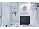 Updated bathroom with glass-enclosed shower and modern vanity at 3191 Marshfield Preserve Way, Kissimmee, FL 34746