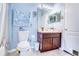 Cozy bathroom with a single vanity, tile flooring, and a shower and tub combination at 3191 Marshfield Preserve Way, Kissimmee, FL 34746