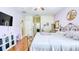 Large bedroom features hardwood floors, ample closet space, and a stylish purple color scheme at 3191 Marshfield Preserve Way, Kissimmee, FL 34746