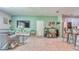 Spacious living area with modern decor, flat-screen TV, and a stylish bar area at 3191 Marshfield Preserve Way, Kissimmee, FL 34746