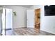 Open living room with hardwood floors and bathroom access at 3191 Marshfield Preserve Way, Kissimmee, FL 34746