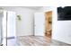 Open living room with hardwood floors and bathroom access at 3191 Marshfield Preserve Way, Kissimmee, FL 34746