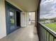 Screened balcony features tile flooring, sliding doors and an open view at 3321 Whitestone Cir # 204, Kissimmee, FL 34741