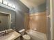 Bathroom features shower-tub combo, single sink vanity, and modern lighting at 3321 Whitestone Cir # 204, Kissimmee, FL 34741