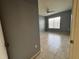 Bedroom features neutral paint, ceramic tile flooring, and a ceiling fan at 3321 Whitestone Cir # 204, Kissimmee, FL 34741