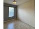 Bedroom features neutral paint, ceramic tile flooring, and window at 3321 Whitestone Cir # 204, Kissimmee, FL 34741