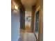 Hallway features ceramic tile flooring and neutral wall paint at 3321 Whitestone Cir # 204, Kissimmee, FL 34741