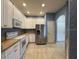 Bright kitchen with white cabinets, stainless steel appliances, and tile flooring at 3321 Whitestone Cir # 204, Kissimmee, FL 34741