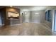 Spacious living area with tile floors and view of the kitchen and dining area at 3321 Whitestone Cir # 204, Kissimmee, FL 34741