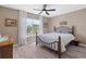 Comfortable bedroom with neutral walls, a ceiling fan, and ample natural light, creating a serene and relaxing atmosphere at 3535 Clay Brick Rd, Harmony, FL 34773