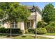 Charming home with lush front yard landscaping, decorative address display, and covered entry at 3535 Clay Brick Rd, Harmony, FL 34773