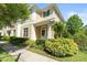 Charming townhome with manicured landscaping, decorative address display, and inviting entrance at 3535 Clay Brick Rd, Harmony, FL 34773