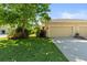 Well-maintained home exterior with manicured lawn, mature trees, and beautiful landscaping, creating inviting curb appeal at 3535 Clay Brick Rd, Harmony, FL 34773