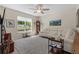 Bright living room with neutral colors, large window with outdoor view, and elegant decor at 3535 Clay Brick Rd, Harmony, FL 34773
