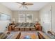 Inviting living room featuring wicker furniture and neutral walls, perfect for relaxation and entertaining guests at 3535 Clay Brick Rd, Harmony, FL 34773