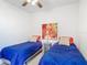 Cozy bedroom with matching twin beds and decor at 4117 Navigator Way, Kissimmee, FL 34746