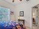 Bright bedroom with window and view to Williams Reserve through open door at 4117 Navigator Way, Kissimmee, FL 34746
