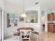 Inviting dining area with decorative lighting fixtures and bar access at 4117 Navigator Way, Kissimmee, FL 34746