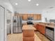 Functional kitchen featuring stainless steel appliances, and an island with space for seating at 4117 Navigator Way, Kissimmee, FL 34746