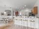 Bright kitchen with bar seating overlooking the dining area, great for entertaining at 4117 Navigator Way, Kissimmee, FL 34746