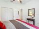Well-lit primary bedroom with ceiling fan, closet and calming decor at 4117 Navigator Way, Kissimmee, FL 34746