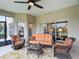 Covered patio with wicker furniture, perfect for outdoor relaxation and entertaining at 4117 Navigator Way, Kissimmee, FL 34746