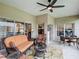 Inviting covered patio features tile floor, ceiling fan, comfortable seating, and views of the yard at 4117 Navigator Way, Kissimmee, FL 34746