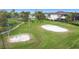 Community recreation area with volleyball court, swings, and work out area on a well-maintained lawn at 4117 Navigator Way, Kissimmee, FL 34746