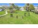 Outdoor workout area featuring bars for calisthenics and other fitness activities on a well maintained lawn at 4117 Navigator Way, Kissimmee, FL 34746