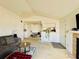 Open living room layout with a fireplace, comfortable seating, and an adjacent dining area enhancing spaciousness at 4301 Lizshire Ln # 308, Orlando, FL 32822