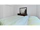 Bedroom featuring a dresser, closet, and wood look tile flooring at 4611 Eaglet Ln, Kissimmee, FL 34746