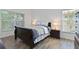 Bedroom features a large window and wood floor at 4611 Eaglet Ln, Kissimmee, FL 34746