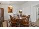 Formal dining room featuring a chandelier, an ornate rug, and wooden furniture at 4611 Eaglet Ln, Kissimmee, FL 34746