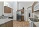 Modern kitchen featuring granite countertops and stainless steel appliances at 4611 Eaglet Ln, Kissimmee, FL 34746