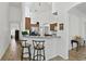 Kitchen bar with granite countertops, a breakfast bar, and stainless steel appliances at 4611 Eaglet Ln, Kissimmee, FL 34746