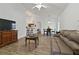 Open concept living room flows into the dining area and kitchen, perfect for entertaining at 4611 Eaglet Ln, Kissimmee, FL 34746