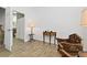 Cozy sitting room off of a bedroom with neutral paint and wood-look tile flooring at 4611 Eaglet Ln, Kissimmee, FL 34746