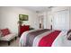 Cozy bedroom featuring patterned bedding, TV and a neutral color palette at 615 Copeland Dr, Haines City, FL 33844