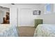 Bright bedroom with twin beds, closet, TV, and open entryways at 615 Copeland Dr, Haines City, FL 33844