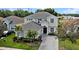 Beautiful two-story home with manicured lawn, elegant entryway, and a spacious driveway at 615 Copeland Dr, Haines City, FL 33844