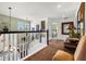 Inviting foyer featuring an open staircase, stylish decor, and a glimpse of a cozy bedroom at 615 Copeland Dr, Haines City, FL 33844