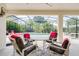 Covered lanai featuring comfortable seating perfect for outdoor relaxation and poolside lounging at 615 Copeland Dr, Haines City, FL 33844