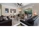 Cozy living room with fireplace, sofas, and sliding glass doors to the outdoor patio at 615 Copeland Dr, Haines City, FL 33844