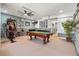 Recreation area featuring a pool table, foosball table, exercise equipment, and a ceiling fan at 615 Copeland Dr, Haines City, FL 33844