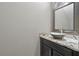 Powder room featuring a decorative vessel sink and granite countertop at 6873 Slaven Dr, Orlando, FL 32819