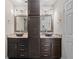Spacious bathroom showcasing dual sinks, granite countertops, and dark wood cabinets at 6873 Slaven Dr, Orlando, FL 32819