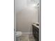 Half bathroom with stylish vanity and neutral decor at 6873 Slaven Dr, Orlando, FL 32819