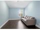 Bedroom featuring hardwood flooring, a neutral color, and natural light at 6873 Slaven Dr, Orlando, FL 32819