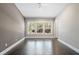 A standard bedroom showcasing bright windows and light walls at 6873 Slaven Dr, Orlando, FL 32819