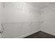 A walk-in closet with metal shelving and dark wood floor at 6873 Slaven Dr, Orlando, FL 32819
